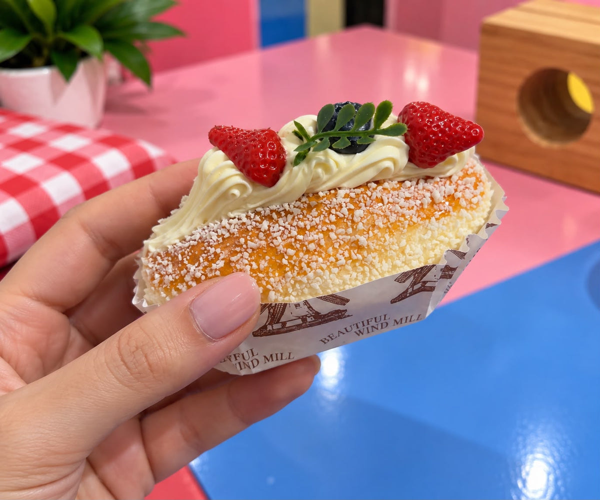 Eclair Squishy, shown in hand for size